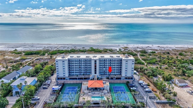 birds eye view of property featuring a water view and a view of the beach