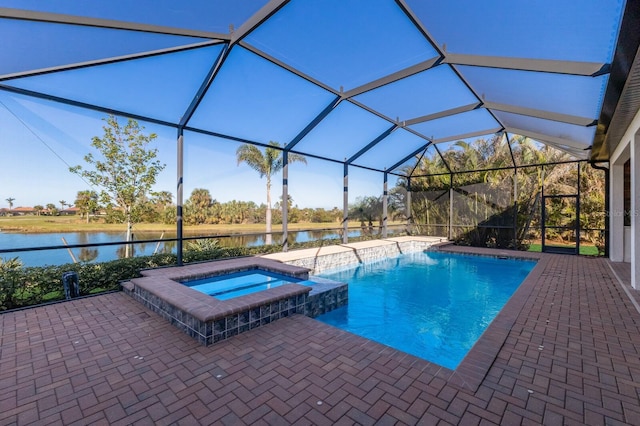 view of pool with a lanai, a water view, an in ground hot tub, and a patio