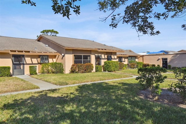 single story home with a front yard