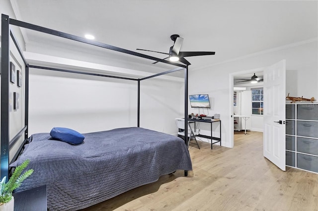 bedroom with ceiling fan, light hardwood / wood-style floors, and crown molding