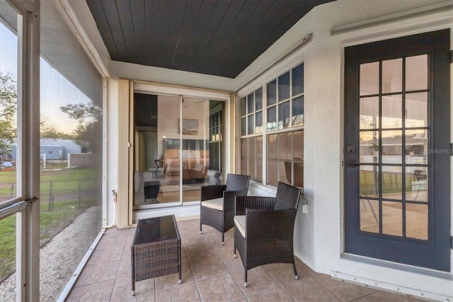 sunroom / solarium with wooden ceiling