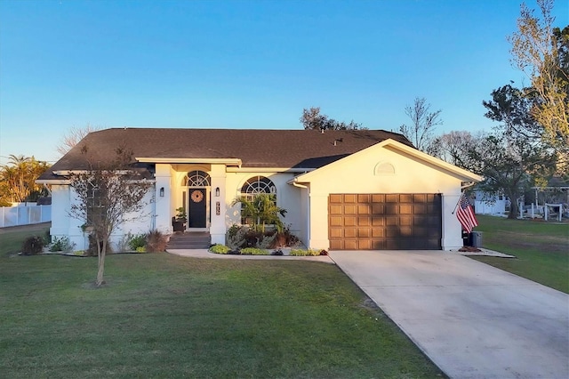 ranch-style house with a front yard and a garage