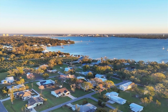 aerial view at dusk with a water view