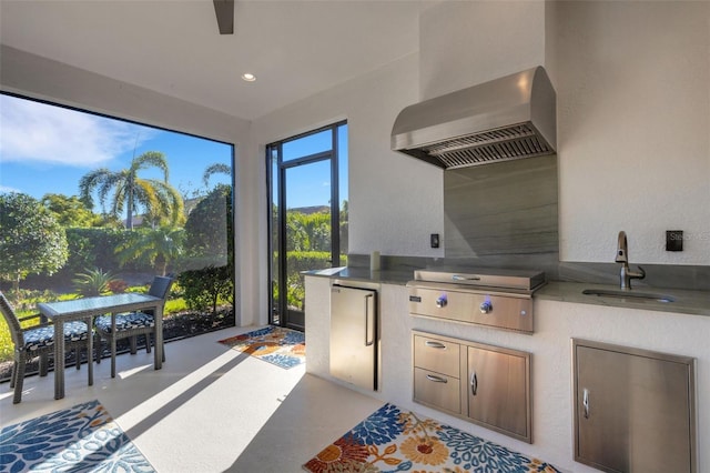 view of patio featuring exterior kitchen, a grill, and a sink