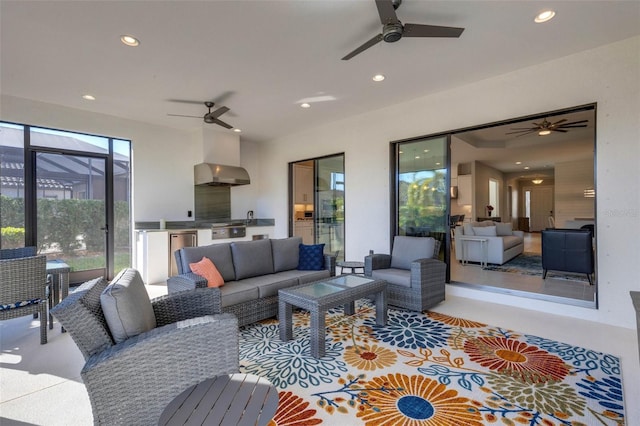 living area featuring a ceiling fan and recessed lighting