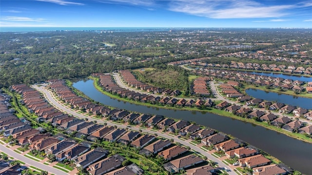 aerial view with a water view and a residential view