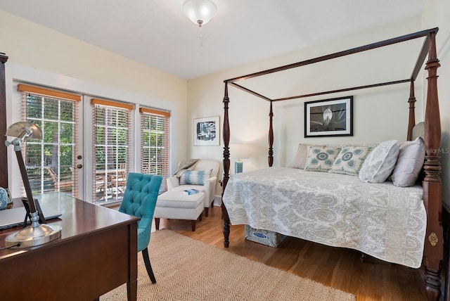 bedroom featuring access to outside and light hardwood / wood-style flooring