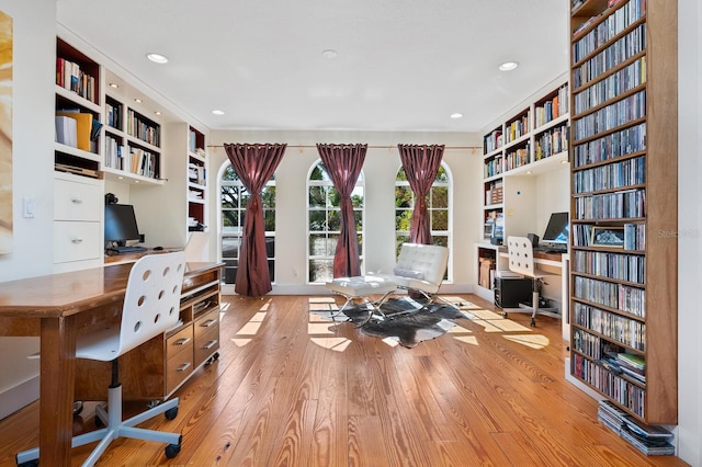 office with light hardwood / wood-style flooring