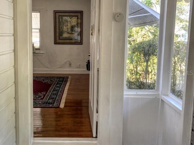 doorway featuring wood finished floors