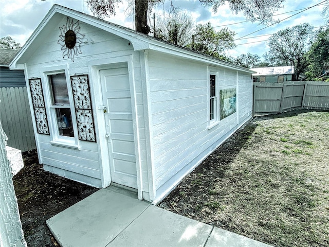 view of outbuilding featuring a fenced backyard and an outbuilding