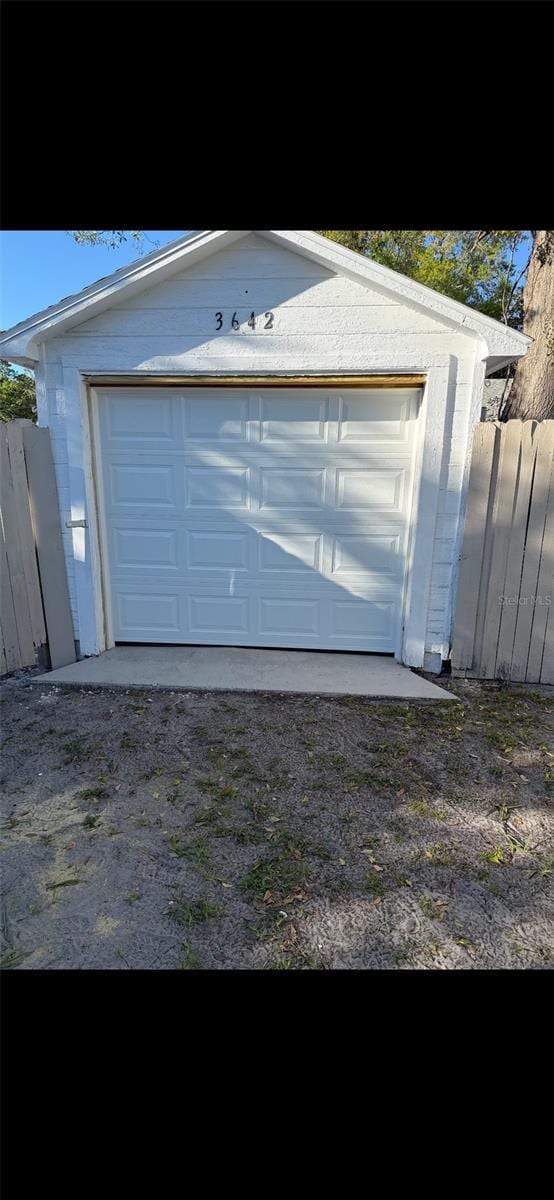 garage with fence