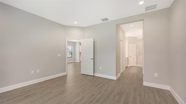 unfurnished room featuring hardwood / wood-style floors