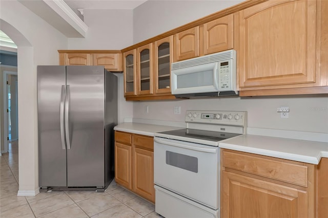 kitchen with light tile patterned floors and white appliances