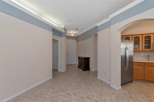 kitchen featuring stainless steel fridge and crown molding