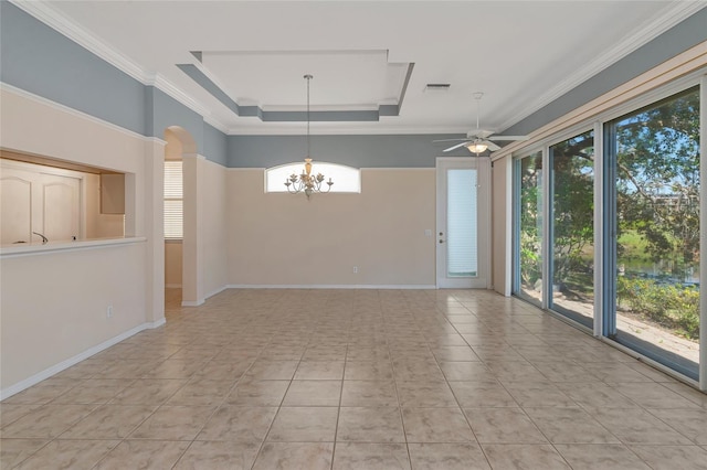 unfurnished room featuring a raised ceiling, light tile patterned flooring, ceiling fan with notable chandelier, and ornamental molding