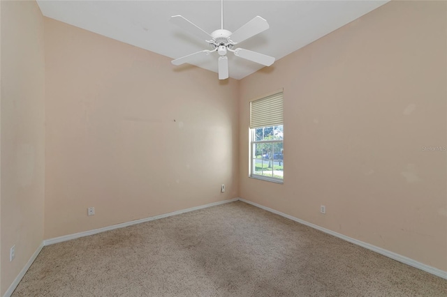 spare room with light carpet and ceiling fan