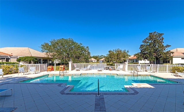 view of swimming pool featuring a patio