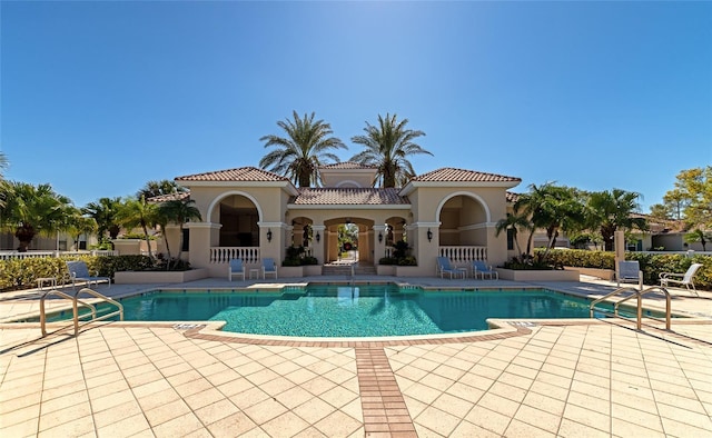 view of swimming pool featuring a patio area