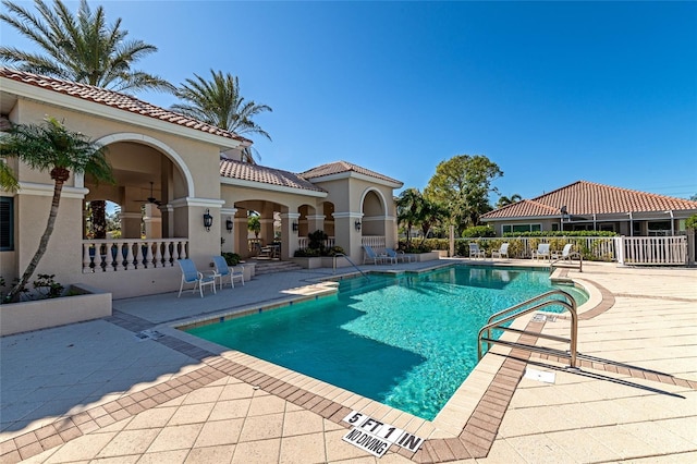 view of swimming pool with a patio