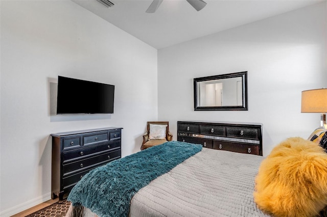 bedroom with ceiling fan and hardwood / wood-style flooring