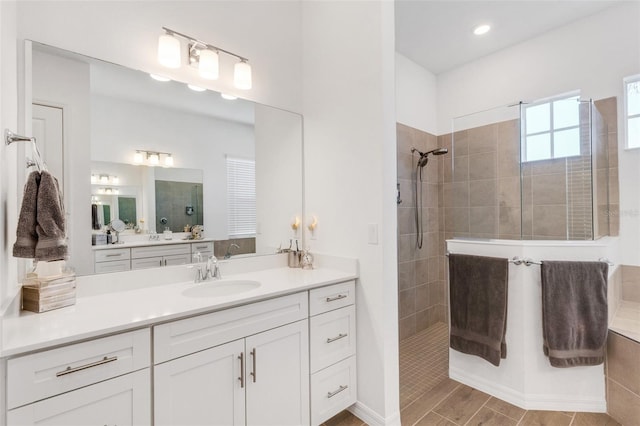 bathroom featuring vanity and a tile shower