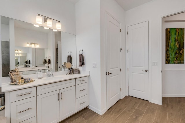 bathroom with vanity and wood-type flooring