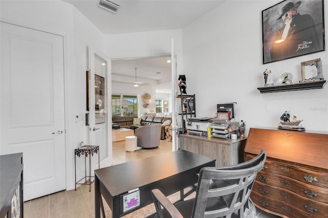 office area with light hardwood / wood-style flooring