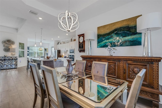 dining space featuring a notable chandelier