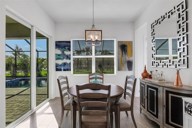 dining room with a notable chandelier and light hardwood / wood-style floors