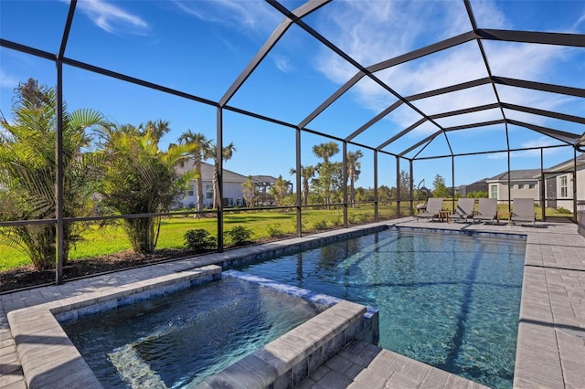 view of pool with a lanai and a patio