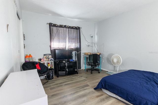 bedroom featuring hardwood / wood-style flooring