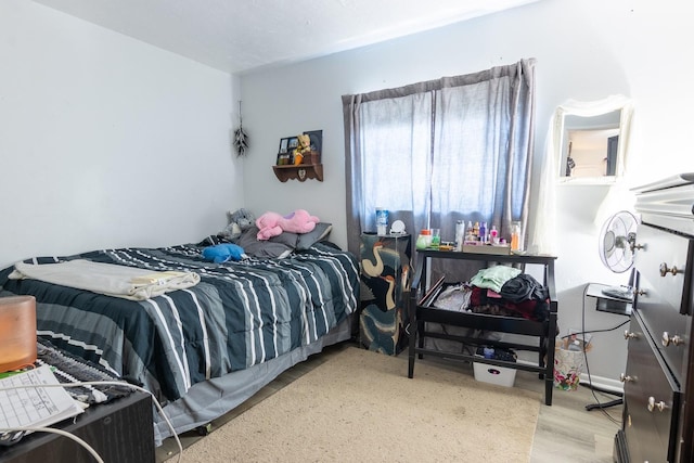 bedroom with light hardwood / wood-style flooring