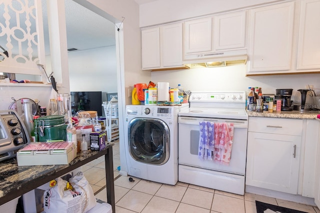 laundry room featuring washer / dryer and light tile patterned floors