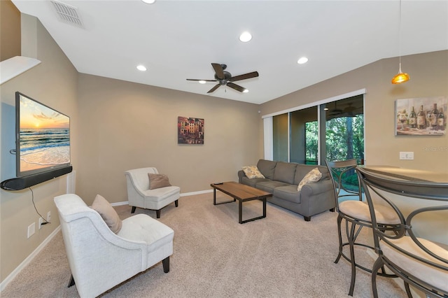 carpeted living room featuring ceiling fan