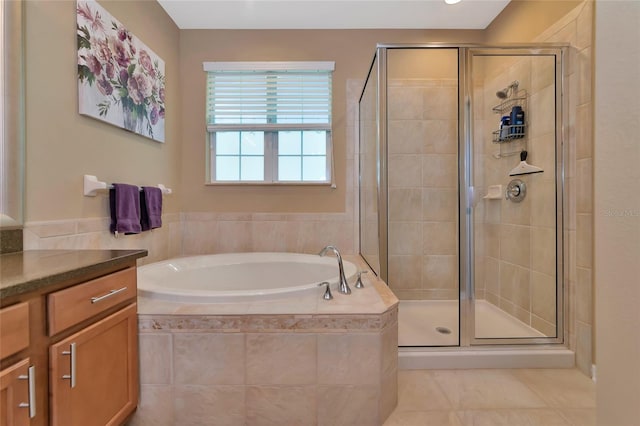 bathroom featuring vanity and separate shower and tub