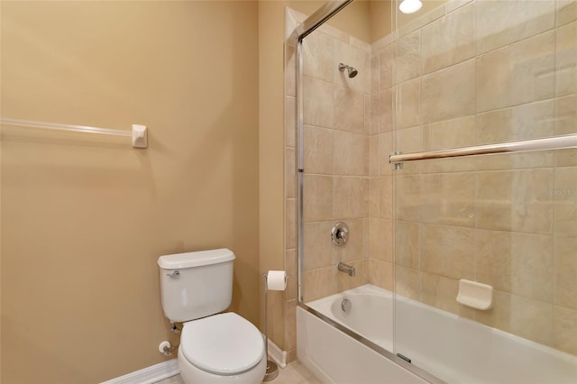 bathroom with shower / bath combination with glass door and toilet