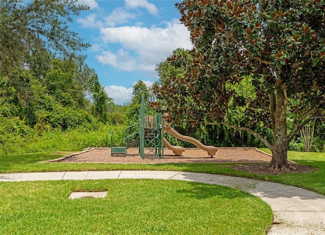 view of jungle gym with a lawn