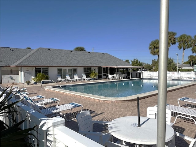 view of swimming pool with a patio area