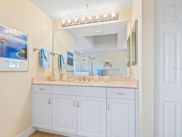 bathroom featuring vanity and walk in shower