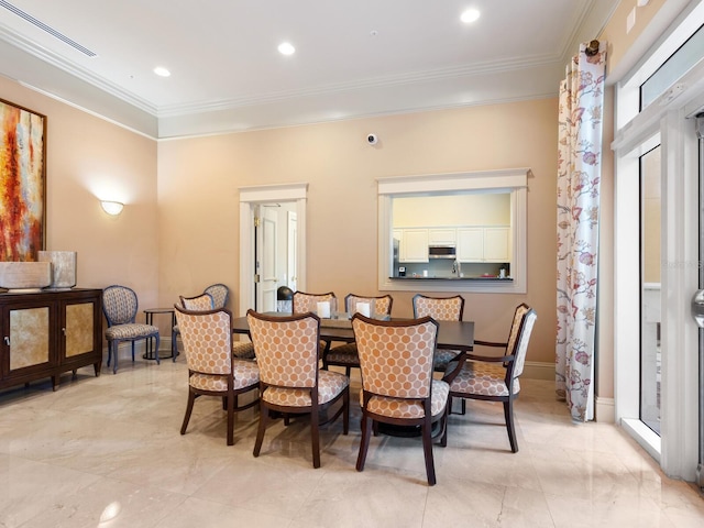 dining room with crown molding