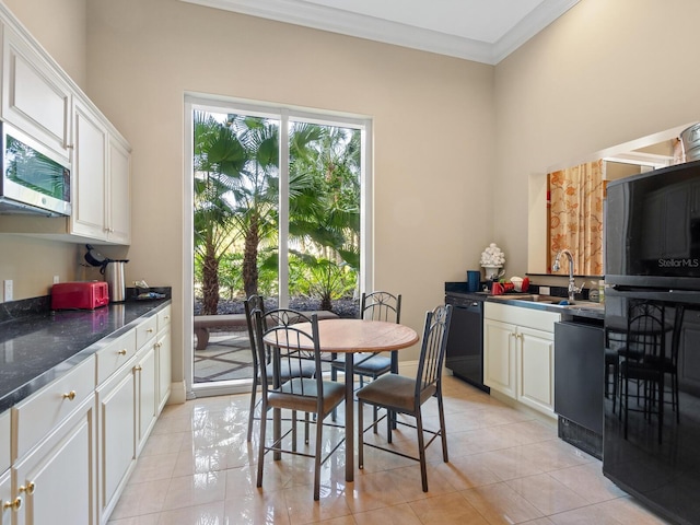 tiled dining space with ornamental molding and sink