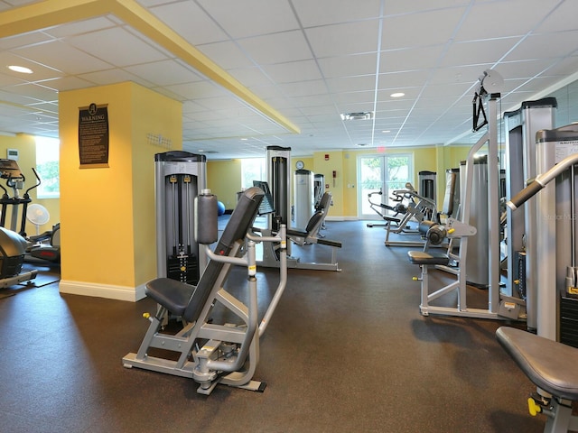 exercise room featuring a paneled ceiling