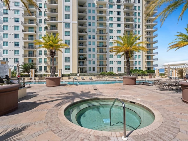 view of pool featuring a community hot tub