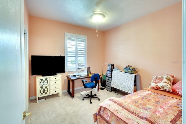 bedroom featuring ceiling fan and light colored carpet