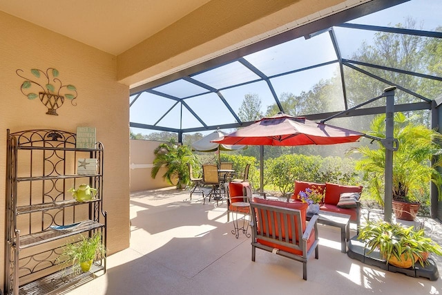 view of patio / terrace with outdoor lounge area and glass enclosure