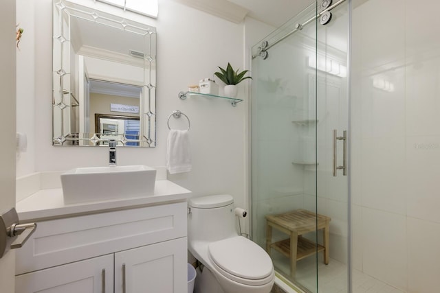 bathroom with vanity, toilet, and a shower with door