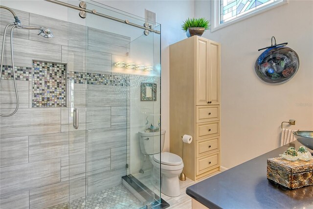7806 Ontario Street Cir Unit 7806, Sarasota, FL 34243 - bathroom with a stall shower and toilet