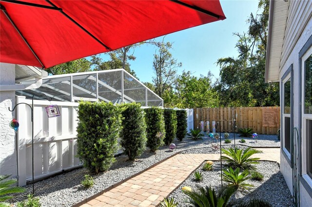 7806 Ontario Street Cir Unit 7806, Sarasota, FL 34243 - fenced backyard featuring a lanai and a patio