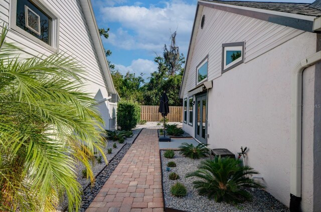 7806 Ontario Street Cir Unit 7806, Sarasota, FL 34243 - view of side of home with stucco siding, french doors, and a patio area