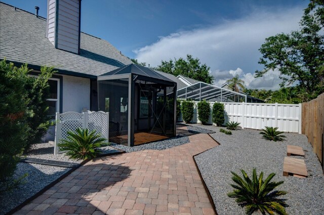 7806 Ontario Street Cir Unit 7806, Sarasota, FL 34243 - fenced backyard featuring a patio area and a lanai